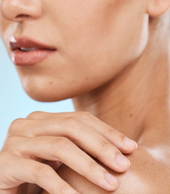 skincare-beauty-and-shoulder-of-woman-on-blue-bac-2023-11-27-05-34-08-utc